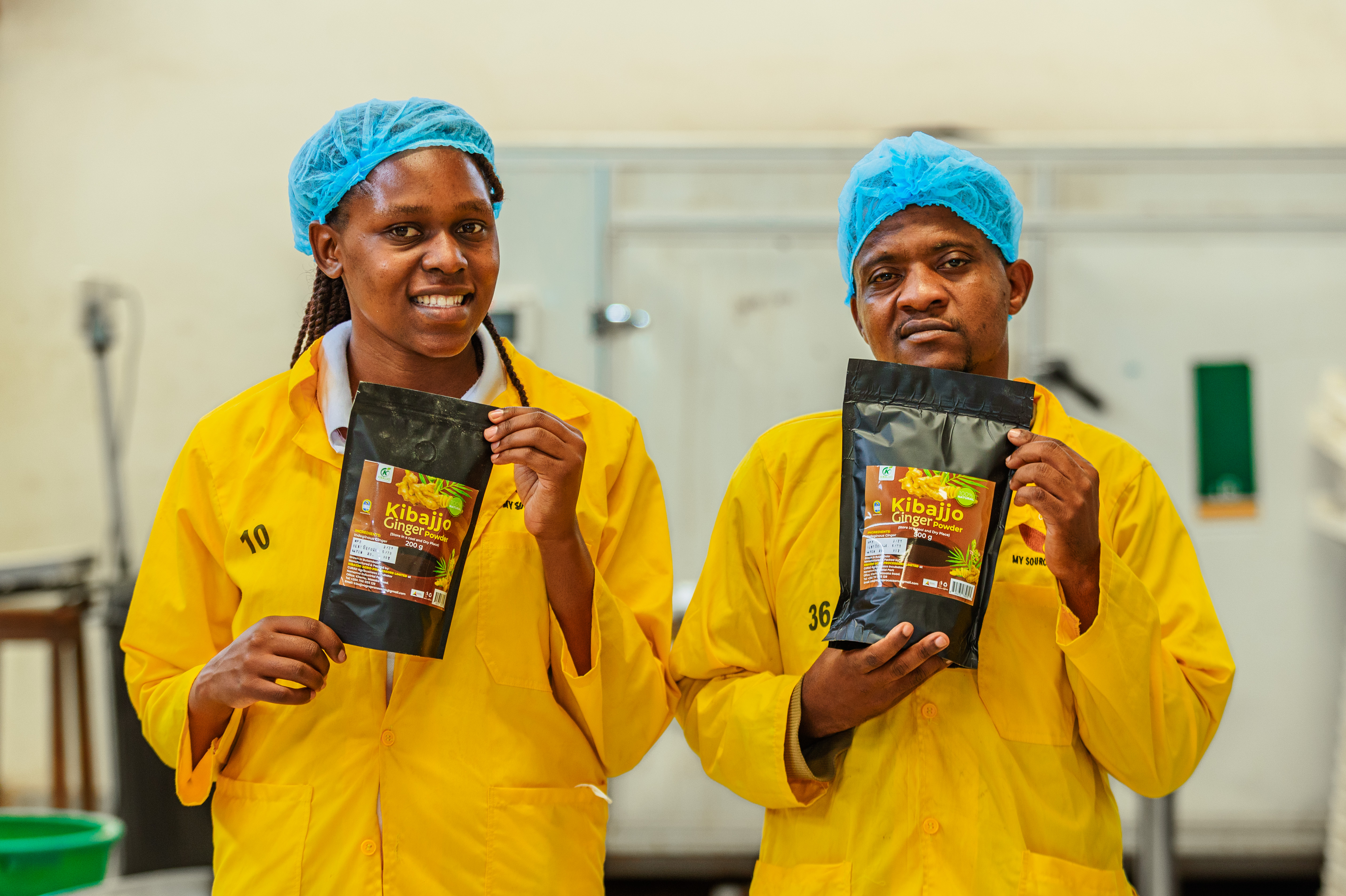 A Kibajjo team member presenting packaged ginger powder